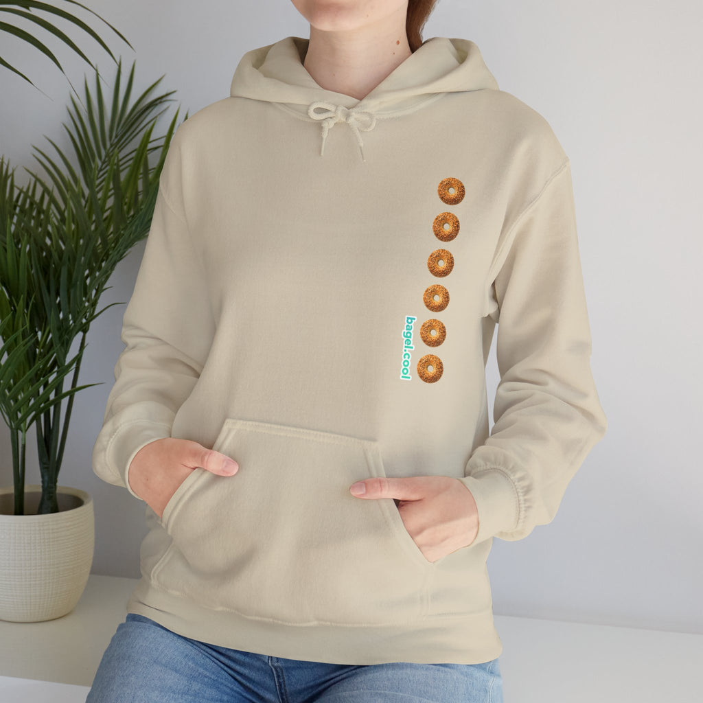 A women wearing a Sand hoodie with a stripe made of bagels on the right