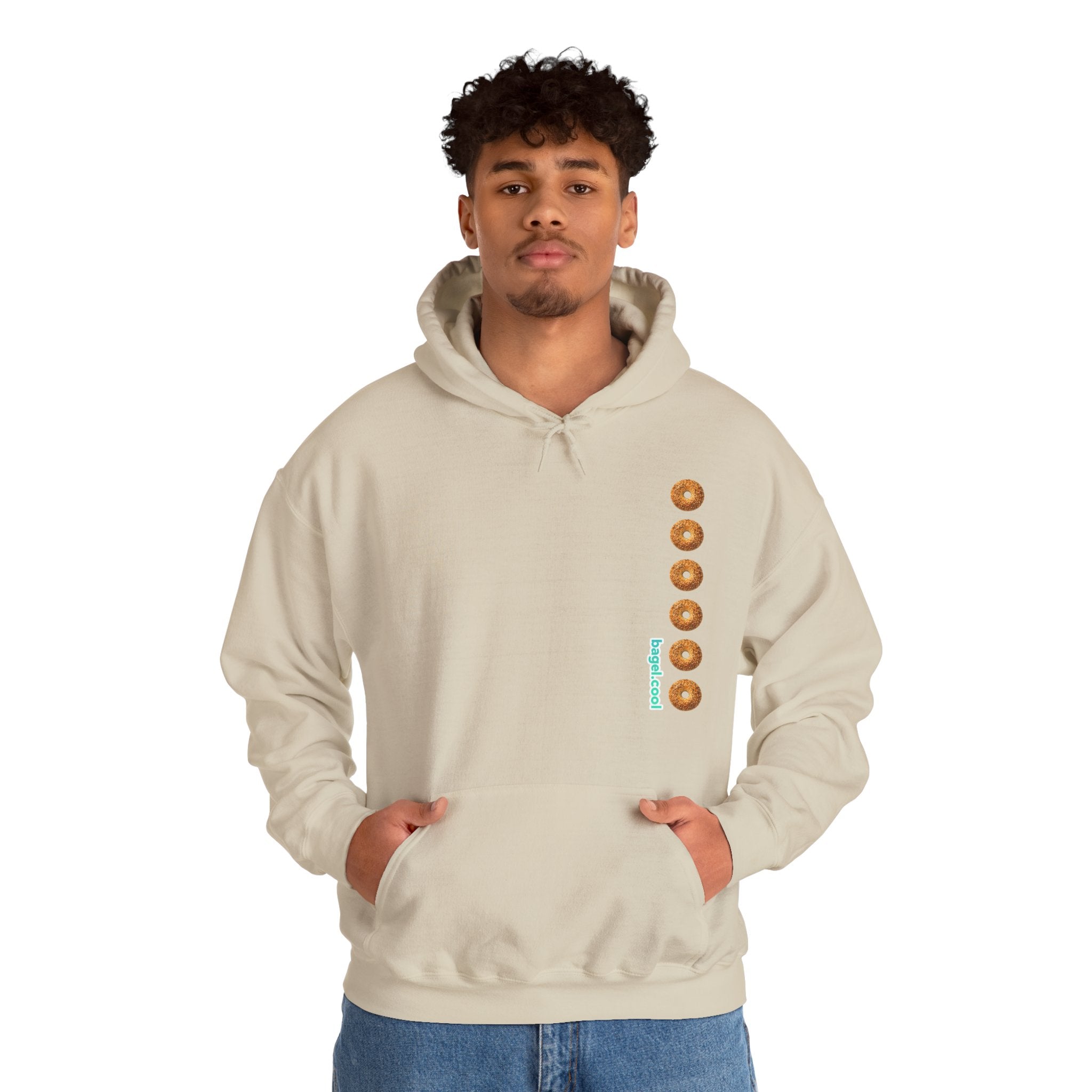 A man wearing a Sand hoodie with a stripe made of bagels on the right